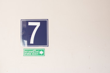 Inside the building on the 7th floor, where the sign is attached.