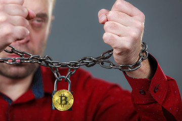 Man being tied up in block chain