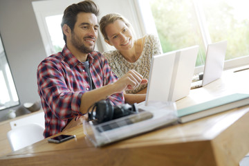 two young colleagues working in an office