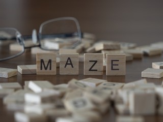 The concept of Maze represented by wooden letter tiles