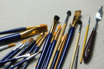 Artist oil Paint Brushes closeup on artistic canvas