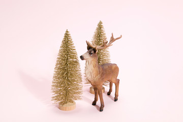 golden christmas tree and reindeer pink