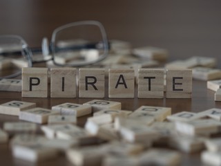 The concept of Pirate represented by wooden letter tiles