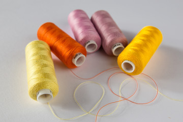 Fototapeta na wymiar spools of thread polyester assorted colors