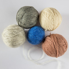 balls of wool threads of different colors and sizes, for knitting