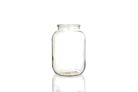 Empty glass jar on white background