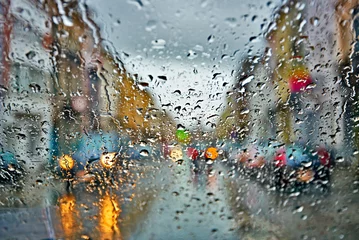 Zelfklevend Fotobehang Car driving in rain and storm abstract background © pbombaert