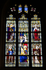 close up view of stained glass window in the historic Notre Dame de Roncier church in Josselin