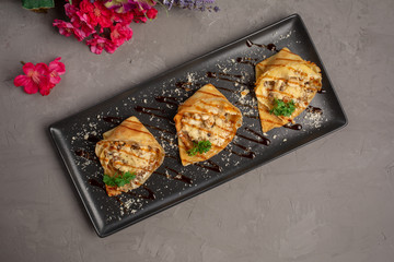 pancakes stuffed with julienne and decorated with greens