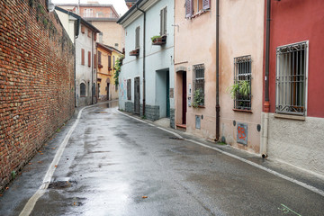Fototapeta premium Narrow street with old houses in the downtown