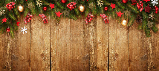 Christmas wooden banner with decoration and fir tree. View with copy space.