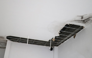 cracks on the ceiling, Water leak on the ceiling tiles from the damaged roof