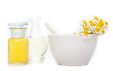 Obraz na płótnie Canvas Essential oil, with flowers and natural herbs