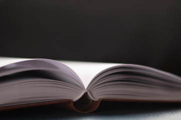 open book on black background