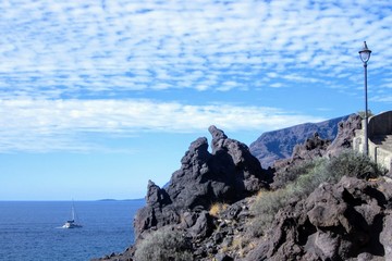 Fototapeta na wymiar Landscape with black volcanic rocks and Atlactic Ocean on the west coast of Tenerife, Canary Islands, Spain