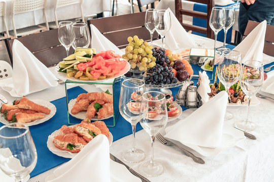 Catering service. Catering food. Table with food at event. Beautifully decorated catering banquet table with different food snacks and appetizers with sandwich.