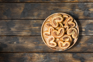 Puff pastry with sugar and cinnamon in a rustic style	