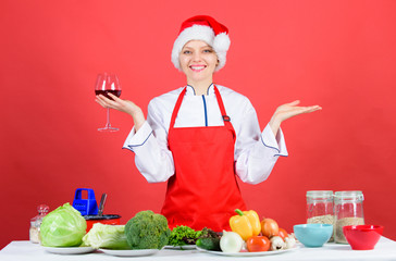 Woman chef cooking christmas dinner wear santa hat. Best christmas recipes. Enjoy easy ideas for holiday parties and holiday dinners. Festive menu concept. Christmas dinner ideas. Christmas menu