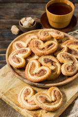 Puff pastry with sugar and cinnamon in a rustic style	