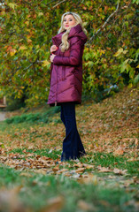 Jackets everyone should have. Best puffer coat to buy. How pick puffer jacket. Puffer fashion concept. Professional stylist advice. Girl fashionable blonde walk in autumn park. Woman wear warm jacket