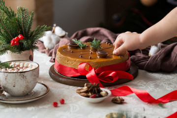 Festive Christmas cheesecake traditional winter cake recipe . Cheese cake whole with red ribbon