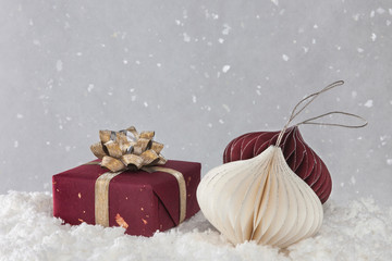 Christmas composition with snow, gift box and Christmas ornaments. Winter, christmas, new year concept.