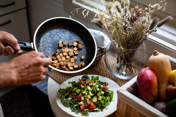 fresh cooking a salad and vegetables