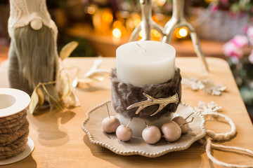Hand made Christmas candle ring at florist's workshop table