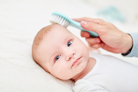 Brush removes dandruff from baby skin