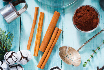 Christmas chocolate truffles and spices on shabby chic blue wood table