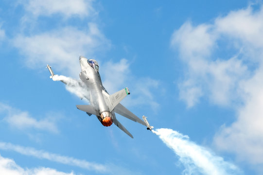 USAF F-16 in a steep climb using reheat over Farnborough, UK - July 24, 2010