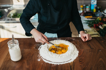Chef making fresh pasta in the kitchen