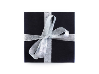Gift in a black package tied with a silver ribbon. White background.