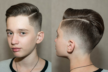 Stylish modern retro haircut side part with mid fade with parting of a school boy guy in a...