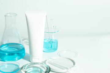 beauty spa medical skincare and cosmetic lotion bottle cream packaging product on white decor background with laboratory science test glass medicine