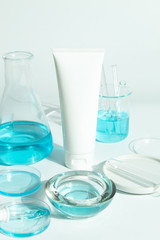 beauty spa medical skincare and cosmetic lotion bottle cream packaging product on white decor background with laboratory science test glass medicine