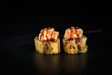 pair of rolls segun close-up on a dark background