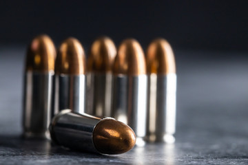 Bullets ammunition on black background. still life concept. - obrazy, fototapety, plakaty