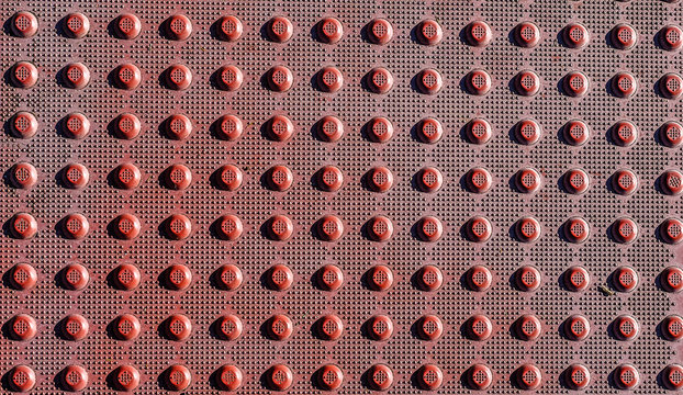 Red Sidewalk Grids at a Crosswalk