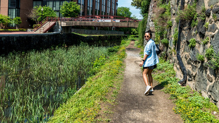 Woman walking down canal toepath in Georgetown, DC