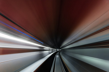 High speed curved motion to the right inside a railway tunnel.