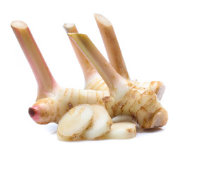 Fresh slices galangal rhizomes isolated on white background