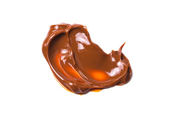 Melted tasty caramel splashes isolated on white background.