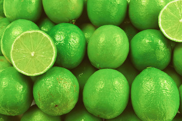 Many fresh limes on white background.