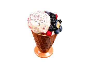 Ice cream with blueberries, blackberries and raspberries on a black background.  Copy space.