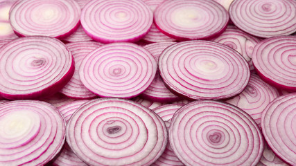 Onion slices as a background. Top view.