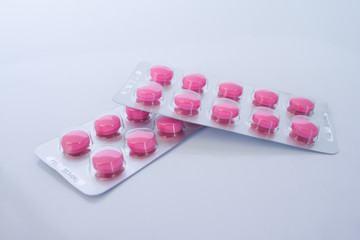 pink tablet medicine in blister pack