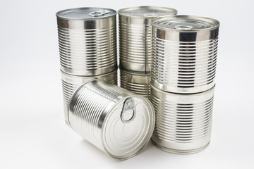 Group of silver canned food on white background.