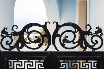 amazingly crafted metal front gate in a small Santorini village in Greece