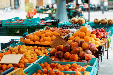 different fruits in ctates on a market